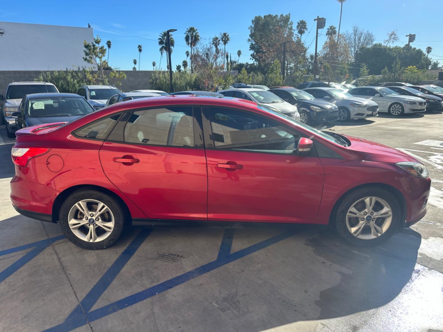 2012 RED /BLACK Ford Focus SE Sedan (1FAHP3F29CL) with an 2.0L L4 DOHC 16V engine, AUTOMATIC transmission, located at 30 S. Berkeley Avenue, Pasadena, CA, 91107, (626) 248-7567, 34.145447, -118.109398 - New Tires! Nice Interior! drives and looks good! Bad credit? We can help! We are the bank. All our cars are thoroughly inspected and reconditioned by our technicians. FREE CARFAX report. Stop by or call to speak with our friendly staff. Whether you have bad credit, no credit, bankruptcy, or reposse - Photo#5